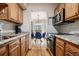 Bright kitchen featuring granite countertops, stainless steel appliances, and stylish subway tile backsplash at 2557 S Dover St # 30, Lakewood, CO 80227