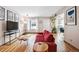 Inviting living room featuring stylish decor, hardwood floors, and an open layout at 2557 S Dover St # 30, Lakewood, CO 80227