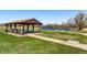 Open picnic shelter with picnic tables provides a relaxing setting by the water at 2557 S Dover St # 30, Lakewood, CO 80227