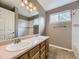 Bathroom features a double sink vanity, large mirror, tile floors and shower at 4267 Ashcroft Ave, Castle Rock, CO 80104