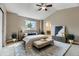 Beautifully staged bedroom with decorative lighting and window view at 4267 Ashcroft Ave, Castle Rock, CO 80104
