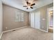 Neutral bedroom with a ceiling fan, closet, window, and carpeted floors at 4267 Ashcroft Ave, Castle Rock, CO 80104