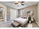 Cozy bedroom features a comfortable bed, stylish decor, and a ceiling fan for added comfort at 4267 Ashcroft Ave, Castle Rock, CO 80104