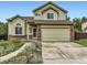 Charming two-story home featuring a well-maintained lawn and inviting curb appeal at 4267 Ashcroft Ave, Castle Rock, CO 80104