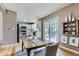 Eat-in kitchen area, featuring stainless steel appliances, white cabinets, and seamless access to outdoor dining at 4267 Ashcroft Ave, Castle Rock, CO 80104