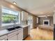 Open kitchen with white cabinetry, stainless steel appliances, and a view to the backyard at 4267 Ashcroft Ave, Castle Rock, CO 80104