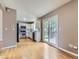 Bright kitchen with white cabinets, stainless steel appliances, and hardwood flooring at 4267 Ashcroft Ave, Castle Rock, CO 80104