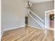 Spacious living room with hardwood floors, staircase, chandelier, and a neutral color scheme at 4267 Ashcroft Ave, Castle Rock, CO 80104