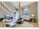 Bright living room boasts vaulted ceilings, staircase, and a large window at 4267 Ashcroft Ave, Castle Rock, CO 80104