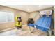 Finished basement space with a Pac-Personal arcade game and a basketball game setup, perfect for recreation and entertainment at 15635 Dawson Creek Dr, Monument, CO 80132