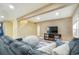 Finished basement featuring a plush couch, television, and a cozy beanbag chair at 15635 Dawson Creek Dr, Monument, CO 80132