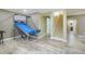 Finished basement with a basketball game, carpeted stairs, and a doorway that leads to a bathroom, perfect for fun at 15635 Dawson Creek Dr, Monument, CO 80132