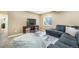 Finished basement featuring a plush couch, television, and a cozy beanbag chair at 15635 Dawson Creek Dr, Monument, CO 80132