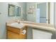 Clean bathroom with a single sink, tile floor, and adjacent toilet at 15635 Dawson Creek Dr, Monument, CO 80132