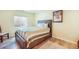 Bedroom featuring a comfortable bed, natural light, and wood flooring at 15635 Dawson Creek Dr, Monument, CO 80132