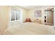 Cozy bedroom featuring a large bed, natural light from the window well, and neutral decor at 15635 Dawson Creek Dr, Monument, CO 80132