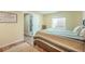 Bedroom featuring a comfortable bed, natural light, and wood flooring at 15635 Dawson Creek Dr, Monument, CO 80132