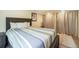 Bedroom featuring a comfortable bed, natural light, and wood flooring at 15635 Dawson Creek Dr, Monument, CO 80132