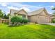 Charming single-Gathering home with manicured lawn, mature landscaping, and a spacious three-car garage at 15635 Dawson Creek Dr, Monument, CO 80132
