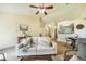 Inviting living room with a couch and views to the dining area and hallway at 15635 Dawson Creek Dr, Monument, CO 80132