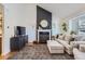 Living room with fireplace and comfortable seating at 9206 Hickory Cir, Highlands Ranch, CO 80126