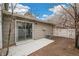 A charming back yard with a concrete patio and a white picket fence for added privacy at 1336 Sable Blvd, Aurora, CO 80011
