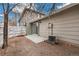Small backyard patio area with fence and A/C unit at 1336 Sable Blvd, Aurora, CO 80011
