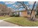 Charming home with a well-maintained front yard, sidewalk, and mature trees at 1336 Sable Blvd, Aurora, CO 80011