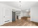 Open floor plan with a modern chandelier and beautiful flooring throughout the living spaces at 1336 Sable Blvd, Aurora, CO 80011