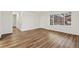 Spacious living room featuring wood floors, bright natural light, and a modern aesthetic at 1336 Sable Blvd, Aurora, CO 80011