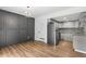 Stylish living space featuring modern gray accents, stainless steel appliances, and contemporary design at 1336 Sable Blvd, Aurora, CO 80011