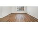 Bright living room with wood-look floors and a large window providing plenty of natural light at 1336 Sable Blvd, Aurora, CO 80011