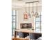Modern dining room featuring a sleek fireplace, ample natural light, and stylish lighting at 1590 Little Raven St # 702, Denver, CO 80202