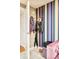 Entryway featuring a colorful striped wall with coats and umbrella at 1590 Little Raven St # 702, Denver, CO 80202