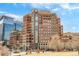 Exterior shot of a modern brick apartment building with city views at 1590 Little Raven St # 702, Denver, CO 80202