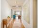 Bright hallway with hardwood floors, contemporary art, and stylish furniture at 1590 Little Raven St # 702, Denver, CO 80202