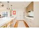 Contemporary kitchen featuring an island with seating, stainless steel appliances, and ample countertop space at 1590 Little Raven St # 702, Denver, CO 80202
