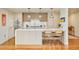 Modern kitchen featuring an island with seating, pendant lighting, and stainless steel appliances at 1590 Little Raven St # 702, Denver, CO 80202