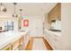 Contemporary kitchen with stainless steel appliances and white countertops with breakfast bar at 1590 Little Raven St # 702, Denver, CO 80202