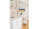 Modern kitchen with white island, quartz countertops, and pendant lighting at 1590 Little Raven St # 702, Denver, CO 80202