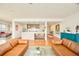 Bright open floor plan with a modern kitchen, hardwood floors, and stylish furniture at 1590 Little Raven St # 702, Denver, CO 80202