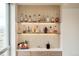 Living room featuring custom lit bar with glass shelves and modern countertops at 1590 Little Raven St # 702, Denver, CO 80202
