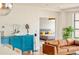 Bright living room leads to bedroom featuring hardwood floors, and modern decor at 1590 Little Raven St # 702, Denver, CO 80202