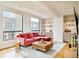 Stylish living room showcasing modern decor, a plush sofa, and a built-in bar area at 1590 Little Raven St # 702, Denver, CO 80202