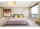 Serene main bedroom featuring a luxurious bed, ample natural light, and stylish bedside decor at 1590 Little Raven St # 702, Denver, CO 80202