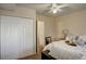 Bright bedroom featuring a ceiling fan and closet with paneled doors at 1885 S Quebec Way # H15, Denver, CO 80231