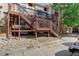 Rear exterior view of townhouse with wooden staircase at 1885 S Quebec Way # H15, Denver, CO 80231