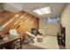 Comfortable home office featuring a decorative wall panel, desk and seating area at 1885 S Quebec Way # H15, Denver, CO 80231