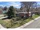 Aerial view showcasing the home's landscaping, mature trees, and neighborhood at 1400 E Bates Ave, Englewood, CO 80113
