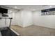 Basement room featuring a treadmill and storage space, creating a functional and organized area at 1400 E Bates Ave, Englewood, CO 80113
